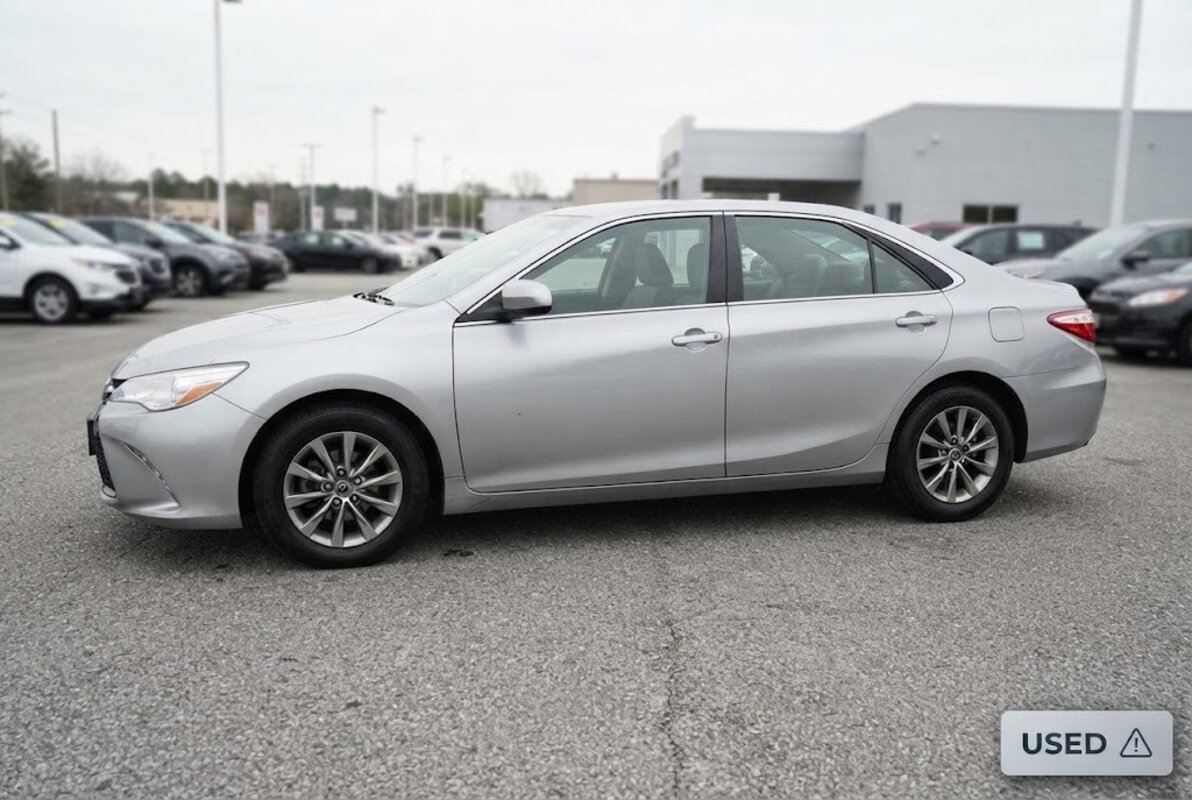 A used sedan on a dealership lot